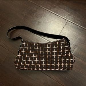 This is a Loft purse. Colors are brown and tan.